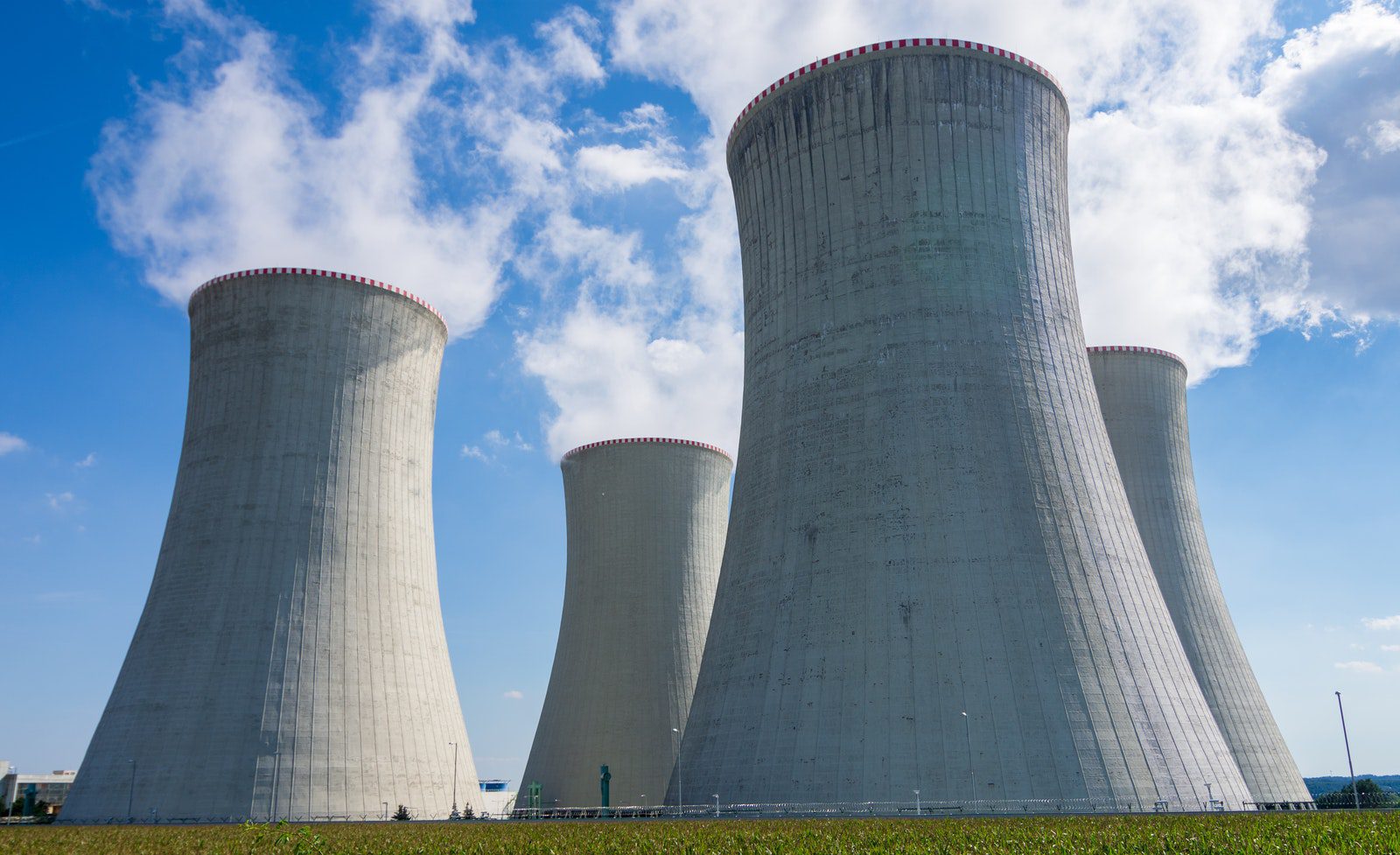 Gray Concrete Towers Under Blue Sky