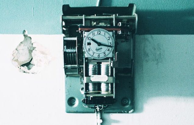 black and gray wall analog clock hang on wall